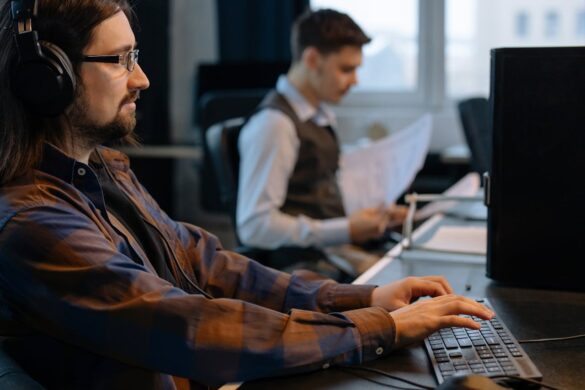 Image source: https://www.pexels.com/photo/men-sitting-at-the-desks-in-an-office-and-using-computers-6803543/