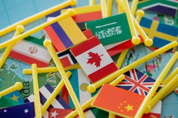 A pile of toy flags with the Canadian flag in the middle.